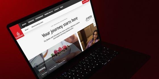 Emirates Airline website on a Macbook laptop